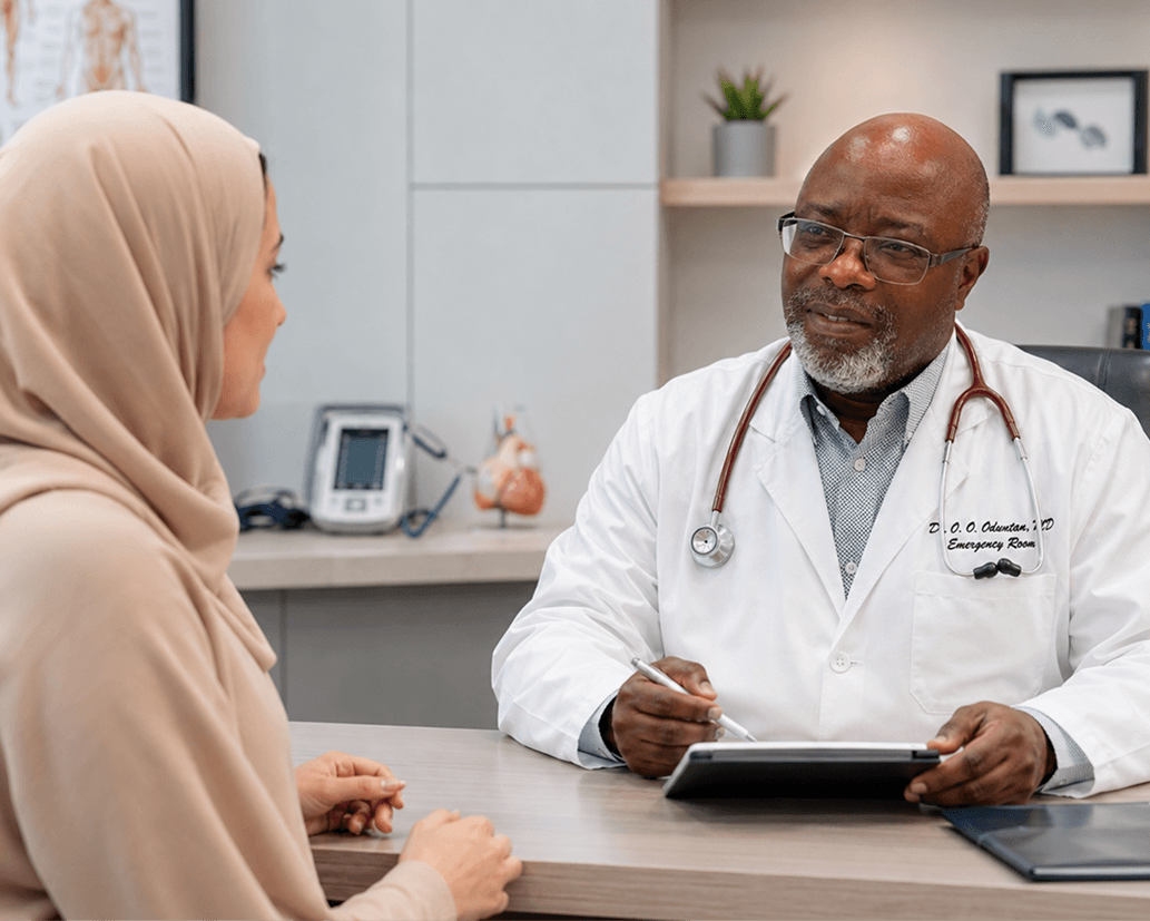 Dr. Oduntan consulting with patient